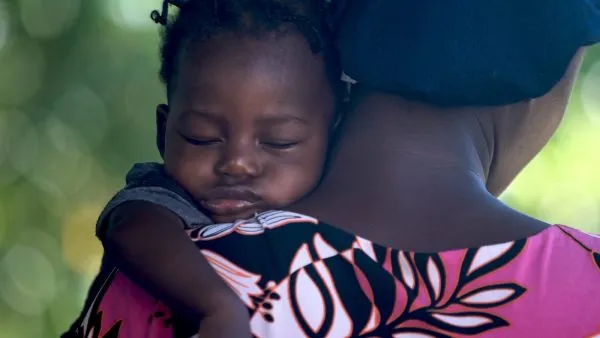 Haitian culture - girls sleeping on mother's shoulder