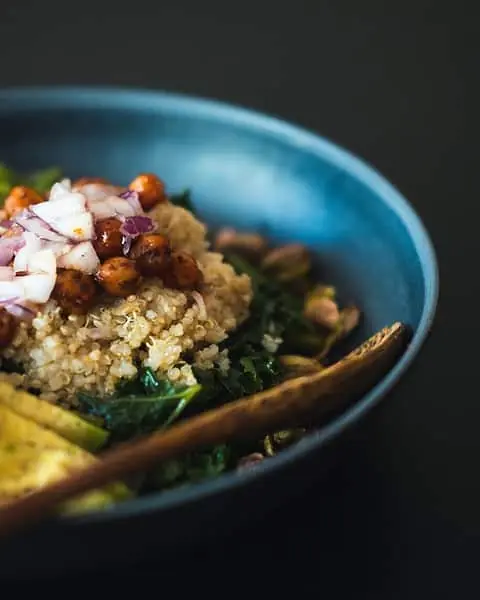 haitian pitimi - quinoa image blue bowl filled with rice and vegetables